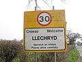 Bilingual English-Welsh sign with speed limit, Llechryd