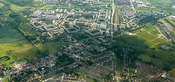 Aerial view of Ahrensfelde (foreground) with Berlin-Marzahn housing estates (background)