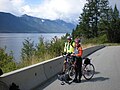 Cyclists on the International Selkirk Loop near Kootenay Lake, British Columbia