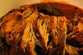 Cochinita Pibil, a fire pit-smoked pork dish, seasoned with achiote, spices and Seville orange