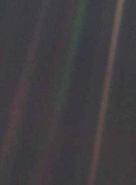 Dark grey and black static with coloured vertical rays of sunlight over part of the image. A small pale blue point of light is barely visible.