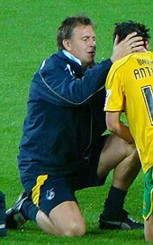 Football physiotherapist Phil Kite attending to an injured player