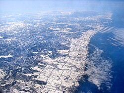 Aerial view of Esashi in the distance with Ōmu in the foreground