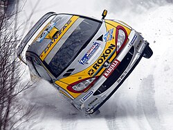 Juuso Pykälistö ja Peugeot 206 WRC Ruotsin rallissa vuonna 2003.