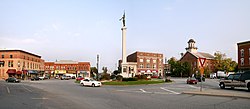 Downtown Angola's traffic circle (or roundabout-- nicknamed "The Mound"), looking east. The monument in the center is dedicated to those who served in the American Civil War. The building with the cupola is the Steuben County courthouse, which is on the National Register of Historic Places.