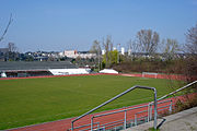 Association football pitch,, surrounded by running track