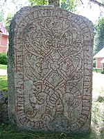 U 1163, the Drävle runestone, showing Sigurd slaying Fáfnir at the top.