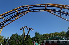 Steel Curtain's zero-g stall over Kennywood's lagoon. Another ride is in the background.