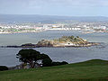 Image 80Northeastward view of Plymouth Sound from Mount Edgcumbe Country Park in Cornwall, with Drake's Island (centre) and, behind it from left to right, the Royal Citadel, the fuel tanks of Cattedown, and Mount Batten; in the background, the hills of Dartmoor. (from Plymouth)