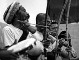 Capoeira is a martial art traditionally performed with a dance-like flavor and to live musical accompaniment, as seen depicted here.