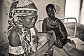 A happy grandmother holds a new baby after a successful delivery at the health post in Mandimba, Niassa Province, Mozambique