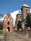 Stairs, monastery gate, and church towers on the right