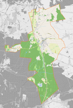 Mapa konturowa Woźnik, u góry nieco na prawo znajduje się ikonka pałacu z opisem „Pałac w Czarnym Lesie”