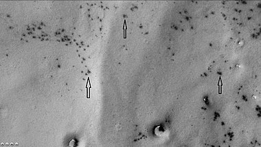 Dark spots and "spiders" in Joly crater, as seen by CTX camera (on Mars Reconnaissance Orbiter). "Spiders" appear as fuzzy spots; they are where dark dust is accumulating in channels below clear slabs of frozen carbon dioxide. Note: this is an enlargement of the previous image of Joly crater.