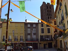 Shops in Arles-sur-Tech, with the Tour Saint-Sauveur in the background