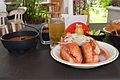 Torta ahogada accompanied by light beer, Jalisco