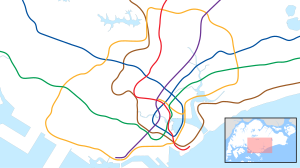 A map of the Singapore rail systems, with a colour for each line, and a red dot highlighting the location of Dhoby Ghaut station in central Singapore.