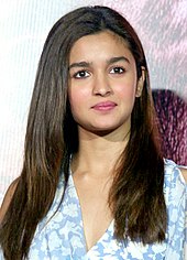 Alia Bhatt is smiling at the camera