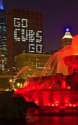 CNA's building with wording formed by office lights through windows "Go Cubs Go".