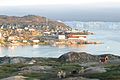 Ilulissat, old part of the city with icebergs from the Ilulissat Icefjord in the background