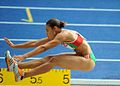 Image 13Naide Gomes in the jumping phase of the event (from Track and field)