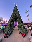 Decorative walk-trough Christmas tree at Mission San Juan Capistrano festival, Southern California, December 2023