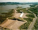 An emergency spillway with fuse plug (bottom) and an auxiliary ogee spillway (top) at New Waddell Dam