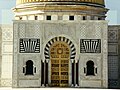 Main door of the mausoleum, made out of teak, with inscriptions in Arabic saying "the supreme fighter, builder of modern Tunisia, liberator of women