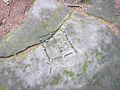 Mittelalterliche Mühle-Petroglyphe auf dem Felsburgstall Teufelsstein in den fränkischen Haßbergen