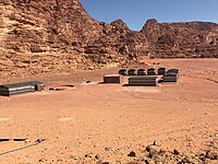 Secluded traditional Bedouin camp protected by mountains