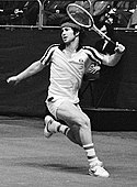 John McEnroe, won the most titles (singles & doubles) in the Open Era (155).