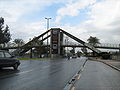 a pedestrian bridge at the entrance