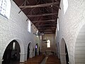 The exposed timber ceiling