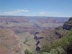 (view due-north, northeast, from Bright Angel Trail, (South Rim section) – View of south-draining Bright Angel Canyon, containing in its lowest section with the Tapeats Sandstone, upon the Granite Gorge, the cliffs of gray-brown Muav Limestone (25% at base of Redwall Limestone), laid upon the slope-forming & greenish Bright Angel Shale. (The trail also descends/ascends through units on the South Rim, at near photo view.)