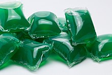 A pile of green laundry pods