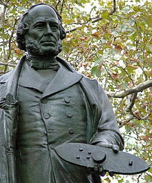 Photo of Statue of John Ericsson in Battery Park, New York City, holding a model of Monitor in his hand