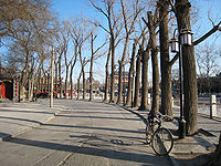 Beijing's Xicheng District with the Gulou and Zhonglou bell and drum towers viewed from a distance; this area is known for its concentration of historic siheyuans (courtyard houses).