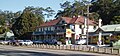 The pub and general store at Ourimbah show a scene which is familiar in most towns.