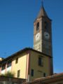 Campanile della chiesa e scorcio della casa parrocchiale