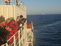 Tourists watch whales in the Drake Passage