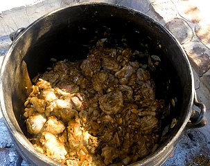 Lamb shanks cooked on an open fire in Aroab, Namibia