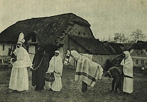 A St. Nicholas procession with Krampus and other characters, c. 1910