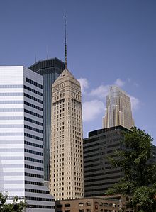 A slender skyscraper with an antenna spire