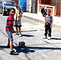 Image 25Plaquita, a Dominican street version of cricket. The Dominican Republic was first introduced to cricket through mid-18th century British contact, but switched to baseball after the 1916 American occupation. (from Culture of Latin America)