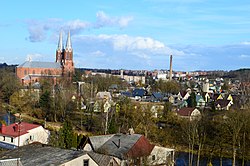 View of the city with the Anykščiai Church, the tallest church in Lithuania, on the left