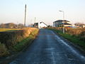 Looking towards Montgreenan with the new houses on the site of the old Community Hall and tennis court, with the old 'Rosebank' colliery ruins in the background