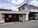 神崎自転車預かり所 中央に金田一レンタサイクルの暖簾がかかっている。