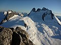 North aspect of Howser Spire (right) above Vowell Glacier viewed from Bugaboo Spire. (Pigeon Spire to left)