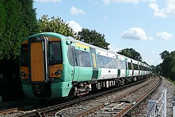 The back of a Southern train leaving Warnham station in West Sussex, as it heads for Horsham railway station