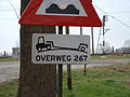 OB618: Uneven road, larger trucks or other big vehicles may get stuck. This sign is placed before a railroad crossing.